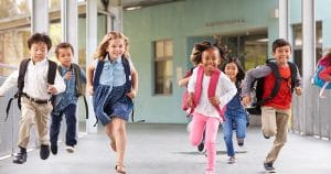 Kids running outside of school